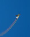 Plane with colored smoke Royalty Free Stock Photo