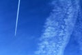 Plane with contrails