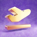 Plane departure icon. Gold glossy Plane departure symbol isolated on violet velvet background.