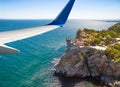 Plane flies above Crimea, Black Sea Royalty Free Stock Photo