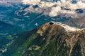 Plane flying above mountains Chamonix, Mont Blanc, Haute-Savoie, Alps, France Royalty Free Stock Photo