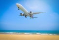 Plane flying on blue sky with cloud background over beach and tr Royalty Free Stock Photo