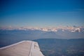 Plane flying next to the french alps Royalty Free Stock Photo