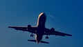 Plane flying up in the sky, silhouette, closeup view Royalty Free Stock Photo