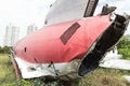 Plane fuselage wreckage sitting on the ground