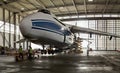 The plane in the harbor-the world`s largest Russian cargo plane Ruslan and the people working on it