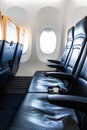 Plane interior - cabin with modern leather chair for passenger of airplane Royalty Free Stock Photo