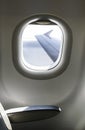 Plane interior sit and window. Airplane wing seen through the window Royalty Free Stock Photo