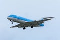 Plane from KLM Cityhopper PH-KZA Fokker F70 is landing at Schiphol Airport.