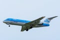 Plane from KLM Cityhopper PH-KZA Fokker F70 is landing at Schiphol Airport. Royalty Free Stock Photo