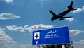 Plane landing in Abu Dhabi United Arab Emirates, UAE airport with signboard