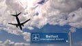 Plane landing in Belfast Ireland airport with signboard