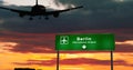 Plane landing in Berlin Germany airport with signboard