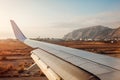 Plane landing in Fira, Santorini island. View of airplane wing. Traveling concept Royalty Free Stock Photo