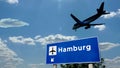 Plane landing in Hamburg Germany airport with signboard