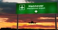 Plane landing in Hannover Germany airport with signboard