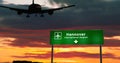 Plane landing in Hannover Germany airport with signboard