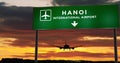 Plane landing in Hanoi Vietnam airport with signboard
