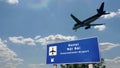 Plane landing in Hanoi Vietnam airport with signboard