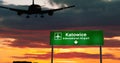 Plane landing in Katowice Poland airport with signboard