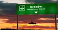 Plane landing in Krakow, Cracow Poland airport with signboard