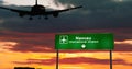 Plane landing in Nassau Bahamas airport with signboard