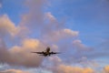 Plane is landing during a nice sunset Royalty Free Stock Photo