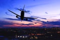 Plane landing in night city. Steep turn of jet airplane over town. Silhouette of aircraft. Danger emergency landing of airliner