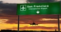 Plane landing in San Francisco, California with signboard