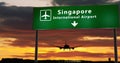Plane landing in Singapore with signboard