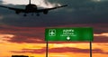 Plane landing in Vientiane Laos airport with signboard