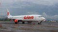 a plane from the Lion Air airline that was landing at Sultan Hassanudin Airport Royalty Free Stock Photo