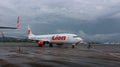 a plane from the Lion Air airline that was landing at Sultan Hassanudin Airport Royalty Free Stock Photo