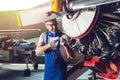 Plane Maintenance Engineer Repairing Engine Royalty Free Stock Photo