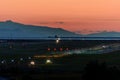 The plane makes landing on the runway at night