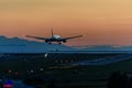 The plane makes a night landing on the runway Royalty Free Stock Photo