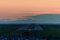 The plane makes a night landing on the runway Royalty Free Stock Photo