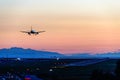 The plane makes a night landing on the runway