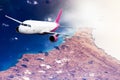 Plane mauve pink sky cloud travel transportion airplane mountains Royalty Free Stock Photo