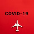 Plane model nd COVID-19 text concept. Flight cancellation due to the impact of coronavirus