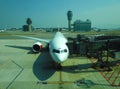 A plane parked in HKIA waiting for passenger to board