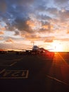 The plane parked and refueled at the airport. Fuselage silhouette at sunset