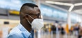 Plane Passenger In Airport Wearing Facemask