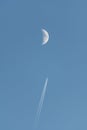Plane passing near the moon Royalty Free Stock Photo