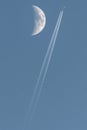 Plane passing near the moon Royalty Free Stock Photo