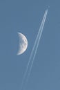 Plane passing near the moon Royalty Free Stock Photo