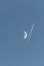 Plane passing near the moon Royalty Free Stock Photo