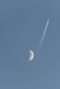 Plane passing near the moon Royalty Free Stock Photo