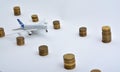 Plane plastic toy with coins isolated on white Royalty Free Stock Photo