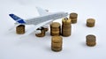 Plane plastic toy with coins isolated on white Royalty Free Stock Photo